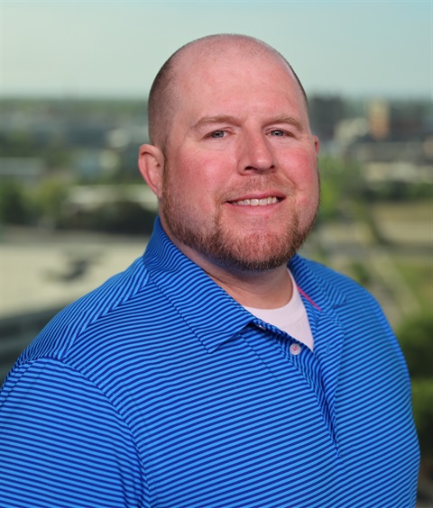 A headshot of Andy Thompson