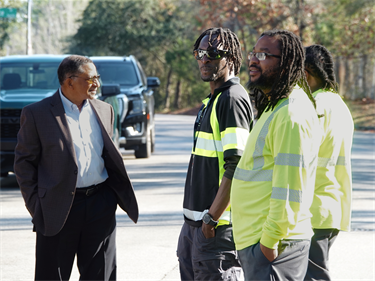 Deputy City Manager Thom Moton speaks with some Parks staffers