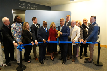 City leaders gather for the ribbon cutting at City Hall at Skyline Center