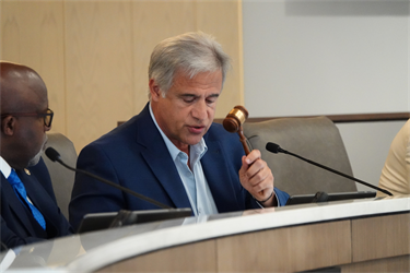 Mayor Bill Saffo gavels out the first meeting inside the new Council Chambers