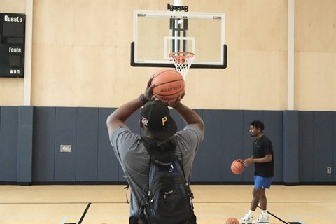 Basketball player shooting hoops.jpg