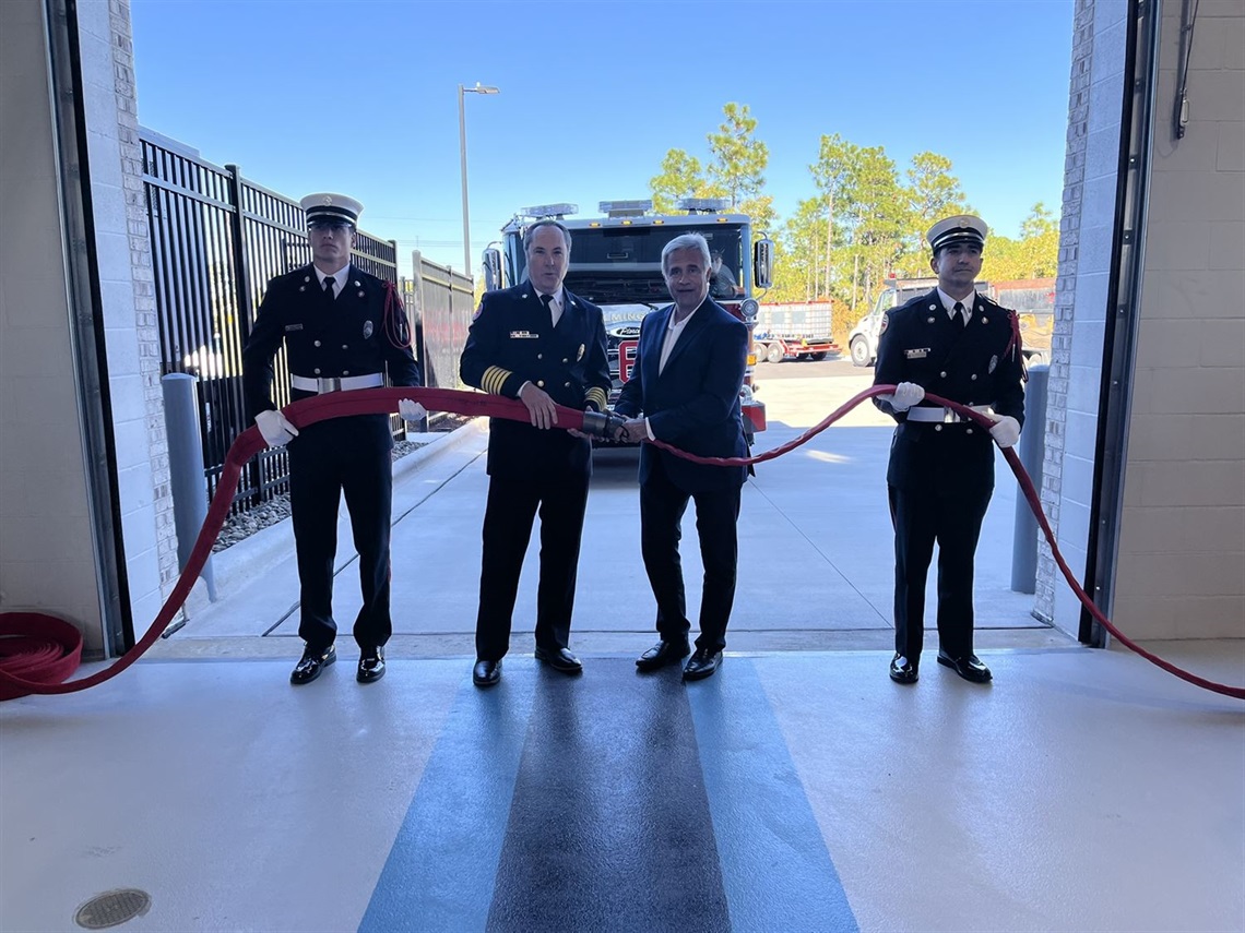 Riverlights fire station opening, Chief Mason uncouples hose with Mayor Saffo