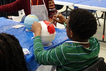 Kids painting buoys