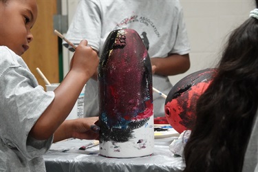 Kids painting buoys