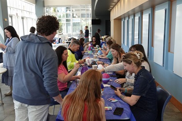 Kids painting buoys