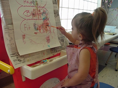 small child painting with easel.jpg
