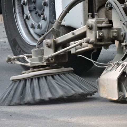 Closeup of street sweeper brush.