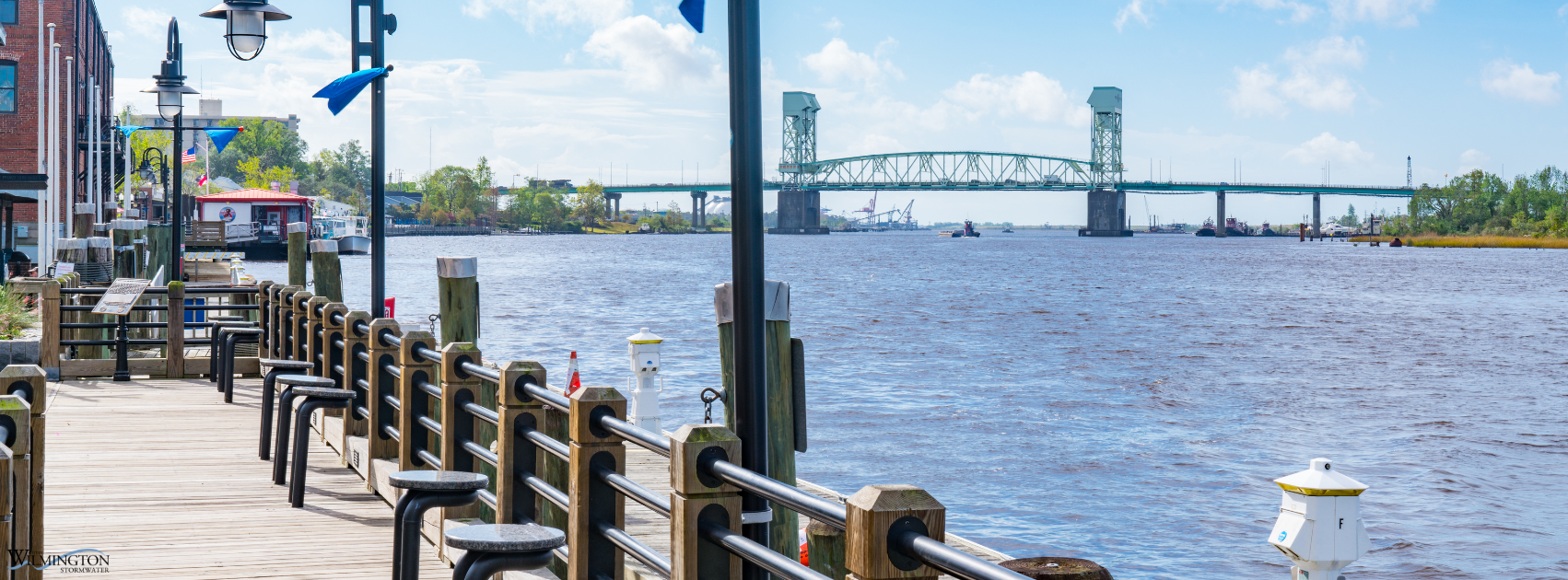 View of Wilmington Riverwalk and Cape Fear Memorial Bridge.