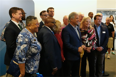 City leaders gather for the ribbon cutting at City Hall at Skyline Center