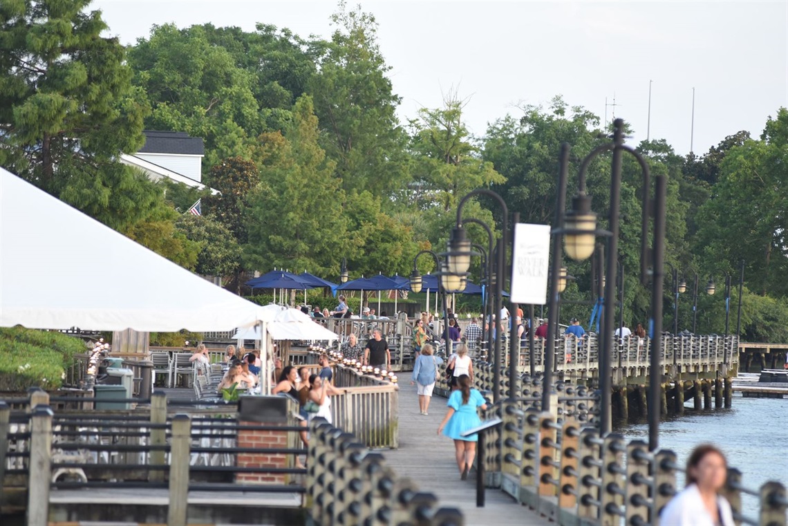 People walking on the Riverwalk in downtown Wilmington