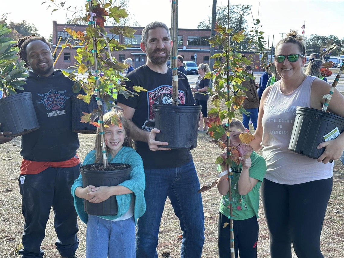 Community picking up some free trees during a previous giveaway